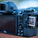 Photo of a mirrorless camera with a memory card in it